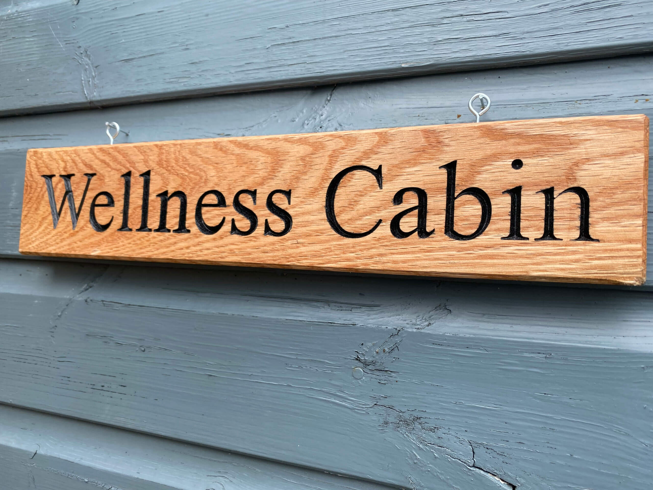 Wellness Cabin Sign on Shed